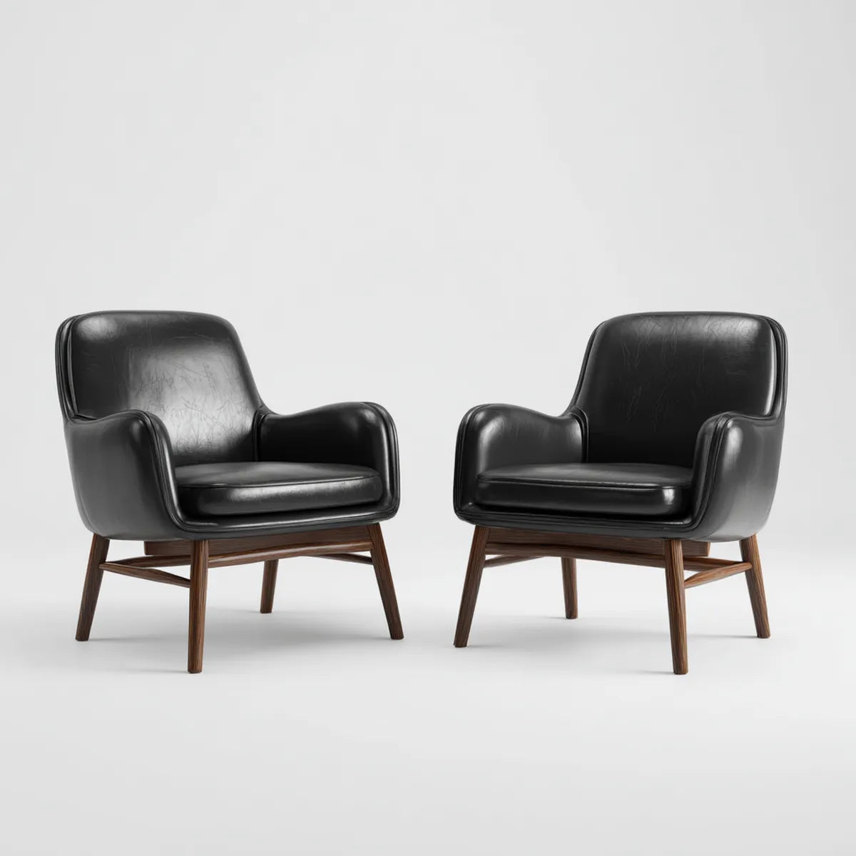 Lot de 2 fauteuils lounge noirs en polyuréthane pieds en hévéa massif forme arrondie 70 x 75 x 82 cm